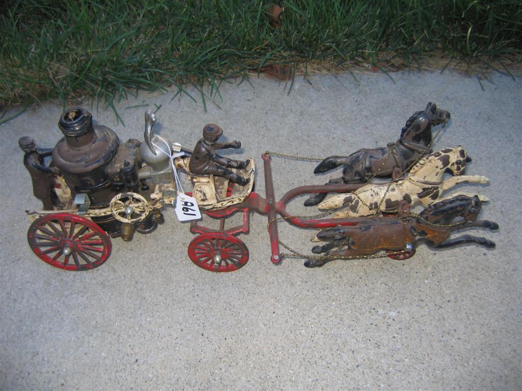 Cast iron miniature fire engine with horses and dr