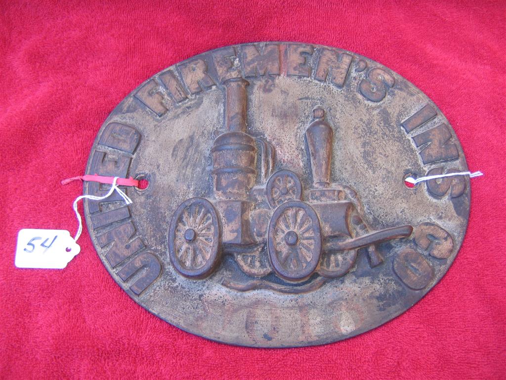 United Firemens Insurance Co. Cast Iron. Oval.