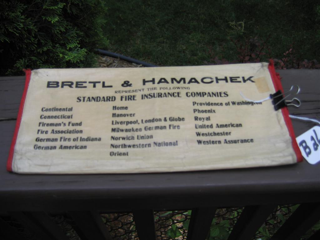 Heavy cloth policy holder. Inside says "We Insure