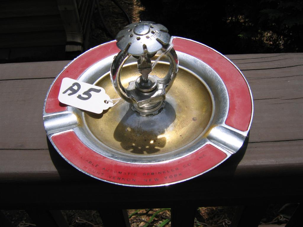 Sprinkler Head Ashtray. Front of ashtray says "Re
