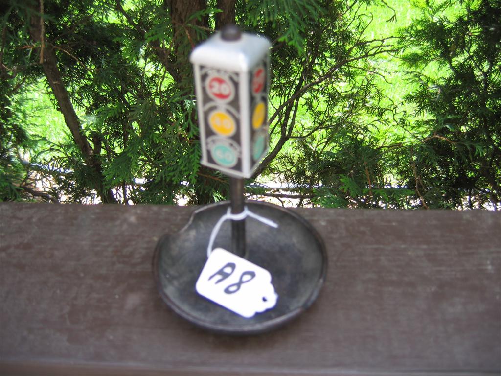 Ashtray. Heavy metal. 6 1/4" tall. Says "We are