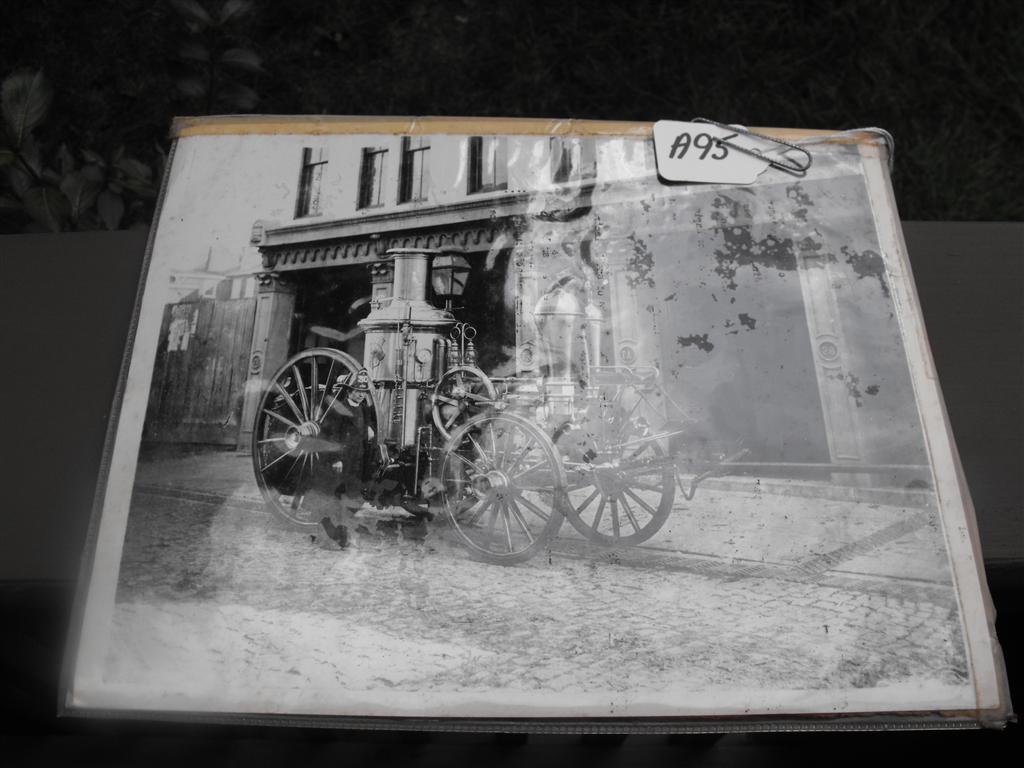 Black and White Photograph of Fire Engine with Fir