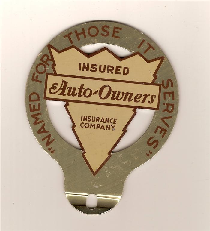 Aluminum Auto-Owners tag emblem. Measures 3.75 inc