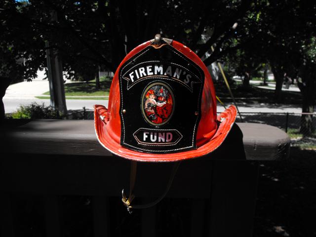 Firemans Fund Helmet. Red metal helmet. Very good