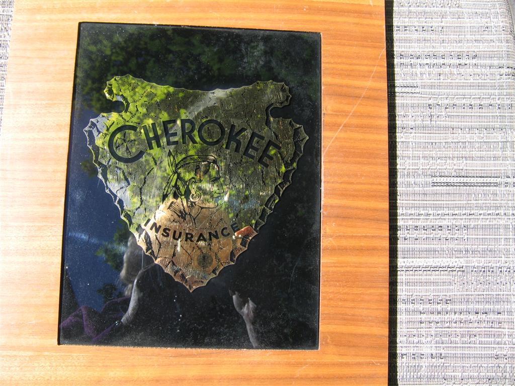 Cherokee Insurance Sign. Wood veneer frame with B