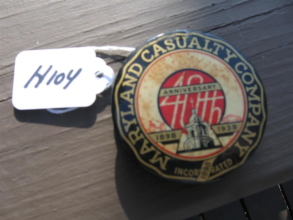 Maryland Casualty metal paperweight. 2 1/4 diamet