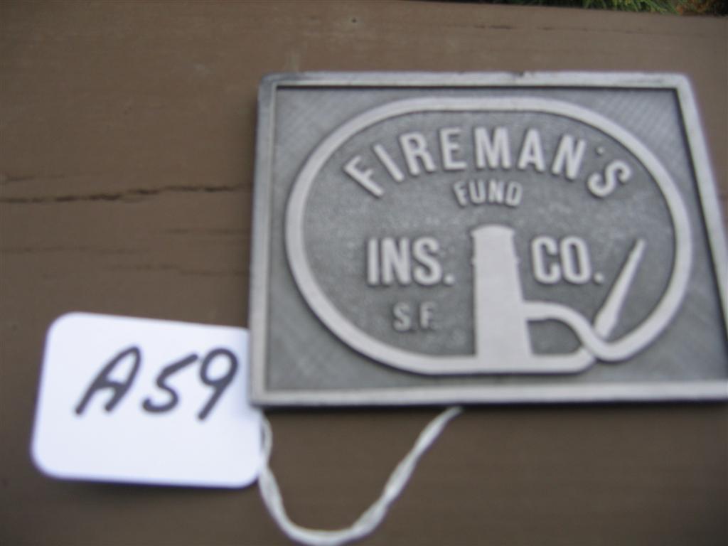 Firemans Fund Ins. Co. Paperweight. Metal. On ba