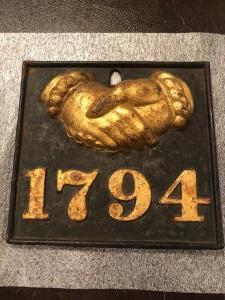 #172 Bulau 61. Baltimore Equitable Society. Baltimore, Maryland. Rectangular.  Heavy Cast Iron. Clasped Hands and "1794" in Raised Gold on Black Backg