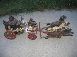 Cast iron miniature fire engine with horses and dr