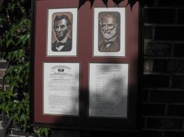 Reproductions of 2 Insurance Applications framed a