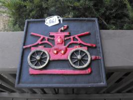 Plaque/sign of Pumper. Heavy metal. 9 1/2" x 8 7