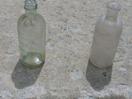Two Glass Acid Bottles. Each are 6 inches high x