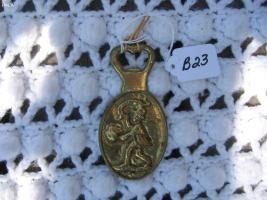 Bottle Opener. Brass Color - probably metal.. Pi