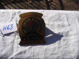 London Assurance Paper Clip. Gold Background with