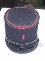 #235 Fireman’s Hat. Dark blue with red trim around top of hat with a red flame on front.
