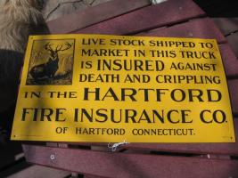 #019 Hartford Livestock Sign. Bright yellow with black lettering. Metal. Given to the Hartford farming Policy holders.